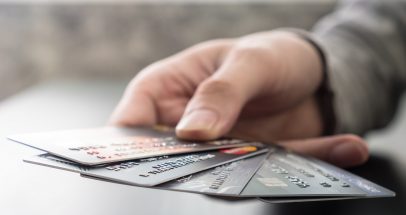 Male hands holding credit cards, soft focus, Online shopping concept.